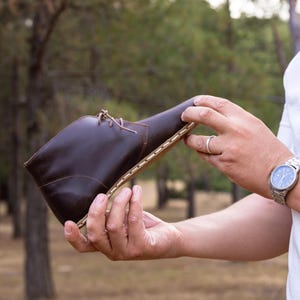 Comfort-focused, durable grounding shoes with artisan touch.