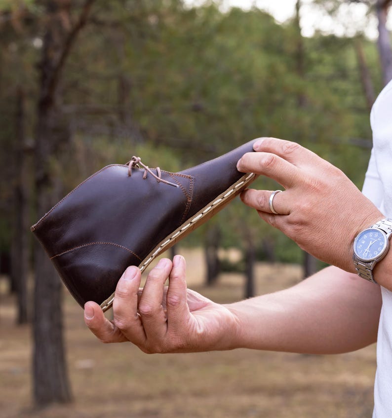 Comfort-focused, durable grounding shoes with artisan touch.