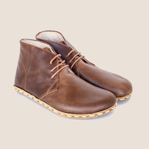 Hand-stitched sole and wide forefoot for true natural walking.