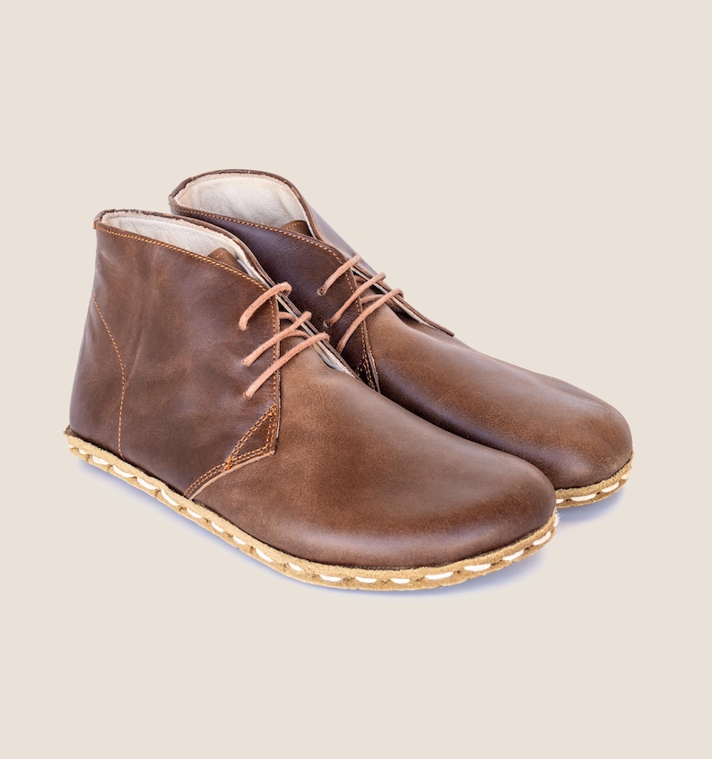 Hand-stitched sole and wide forefoot for true natural walking.