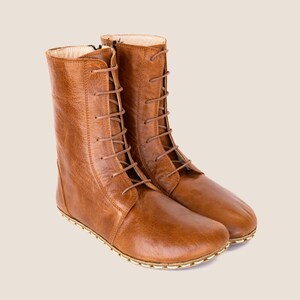 Artisan-made leather shoes inspired by ancient craft traditions.