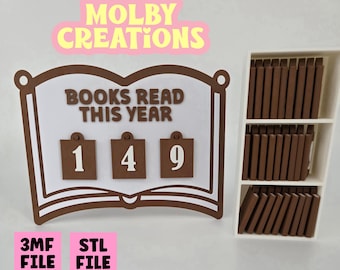 May include: A brown and white book-shaped counter with the text "BOOKS READ THIS YEAR" and the number "149". A small white bookshelf with brown book models is to the right. The text "3MF FILE" and "STL FILE" are in pink boxes.