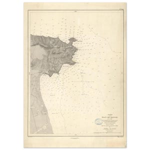 May include: Antique nautical chart of Bougie, featuring detailed coastal topography in shades of gray and beige. The map includes depth soundings and navigational markers, with text in French. A vintage piece for maritime enthusiasts.