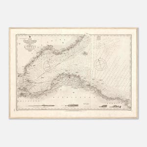 May include: Vintage nautical chart of the Firth of Forth, Scotland, showing coastlines, depth soundings, and navigational markers. The map is printed in sepia tones and framed in a light wood frame.