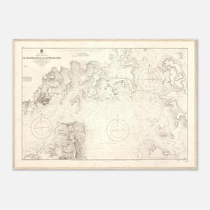 May include: A vintage nautical chart titled La Maddalena and Approaches, printed in black ink on off-white paper. The map features detailed coastal topography, depth soundings, and two prominent compass roses used for maritime navigation.