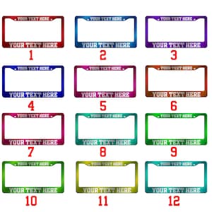 May include: A collection of twelve license plate frames in various colors, including red, blue, purple, and green. Each frame has the text "YOUR TEXT HERE" at the top and bottom, with numbers 1 through 12 below each frame.