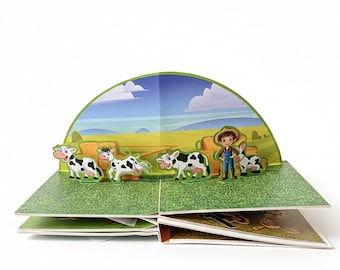 May include: A pop-up book featuring a farm scene with cows, a farmer, and a dog. The cows are black and white, and the farmer is wearing overalls and a straw hat. The background depicts a green field, hay bales, and a blue sky.