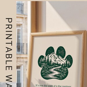 May include: Printable wall art with a green paw print design depicting a mountain and forest. The text "It's not the path-it's the partner" is included. The words "Because You're a DOG MOM" are also visible.