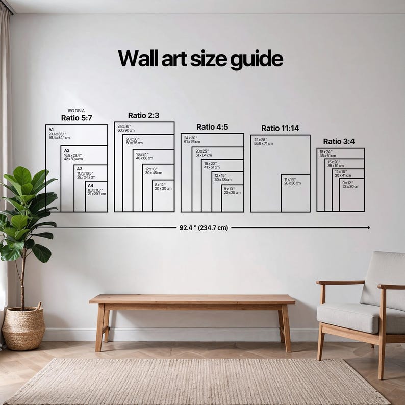 May include: A wall art size guide showing different rectangular shapes with ratios and dimensions in both inches and centimetres. The text "Wall art size guide" is at the top. A wooden bench and chair are in the foreground.