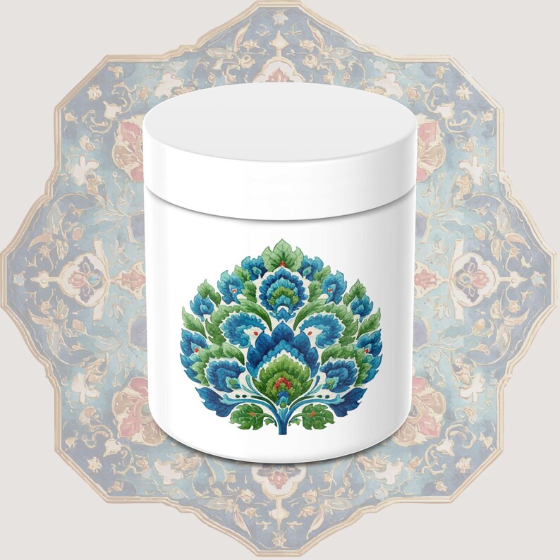 May include: White cylindrical container with a floral design in shades of blue, green, and red. The design is centered on the container. The background features a patterned, ornate design in blue, red, and beige.