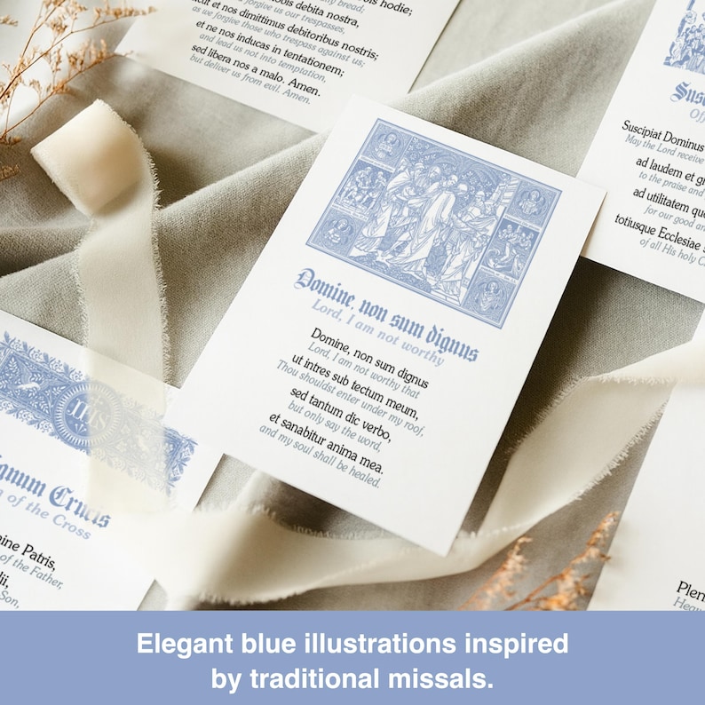 May include: Cards with elegant blue illustrations and text, inspired by traditional missals. The cards feature detailed blue artwork and calligraphy, with a soft, neutral background and white ribbon.