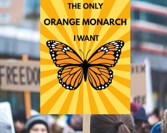 May include: A sign held up in a crowd with the text "THE ONLY ORANGE MONARCH I WANT" above a monarch butterfly illustration. The butterfly is orange and black, set against a yellow burst background.