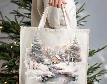 May include: A beige tote bag featuring a watercolor winter landscape. The design depicts a snow-covered scene with a river, trees, and a small cabin. The bag is held by a person.