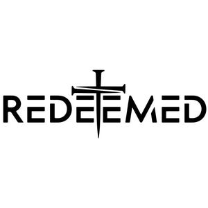 May include: Black text on a white background spells out the word "REDEEMED". The letter "E" in the middle of the word is replaced by a cross with nails, a symbol of faith and redemption.