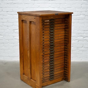 May include: A rustic wooden sign with the text "Welcome to our home" in white lettering. The sign features a distressed finish and a simple, inviting design, perfect for entryway decor.