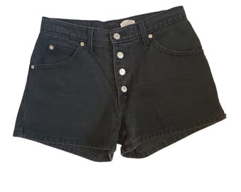 May include: Black denim shorts with a button fly and five pockets.