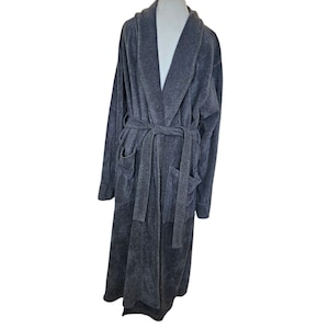 May include: A long-sleeved gray robe with a shawl collar and a self-tie belt. The robe has two patch pockets on the front.