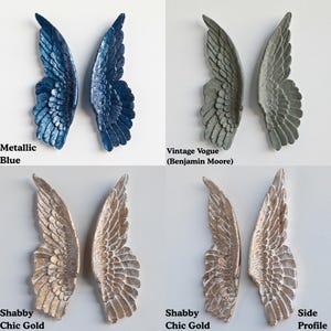 Peut inclure: Quatre paires de sculptures d'ailes d&eacute;coratives de diff&eacute;rentes couleurs. Des ailes bleu m&eacute;tallis&eacute;, des ailes Vintage Vogue (Benjamin Moore) et deux paires d'ailes Shabby Chic Gold sont pr&eacute;sent&eacute;es. Le profil d'une aile est &eacute;galement montr&eacute;.