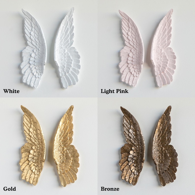 four different colored angel wings, each with a unique color and design.