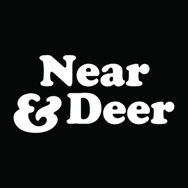 the text "Near & Deer" in a stylized font against a black background.