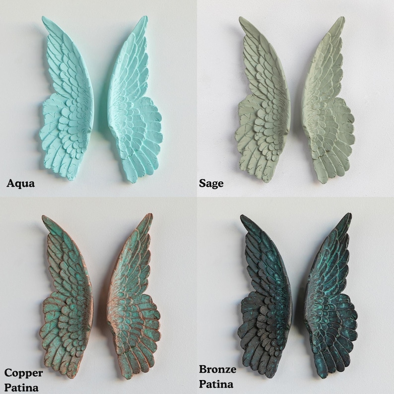 four different colored metal wings, each labeled with a different color: aqua, sage, copper, and bronze.