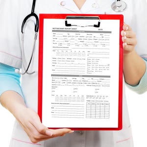 May include: A red clipboard with a Mother-Baby Report Sheet is held by a person wearing a white coat and stethoscope. The report sheet has sections for medical information and a date field.