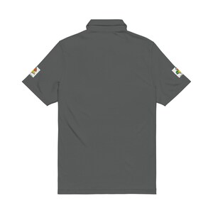The back of a dark gray polo shirt showing a solid design and patches on the sleeve cuffs against a white background.