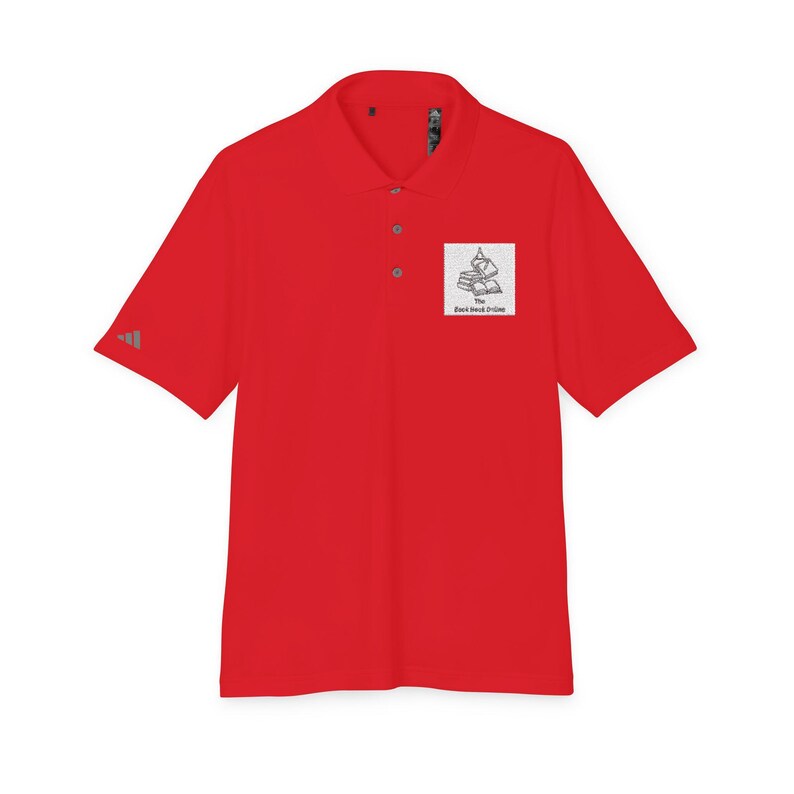 A short-sleeved red polo shirt with a collar, three buttons, and a white square graphic of stacked books with text on the left chest.