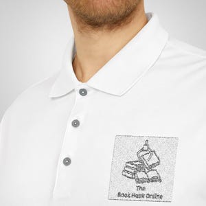 A close-up view of the collar and upper chest of a white polo shirt showing three grey buttons and a square book stack graphic.