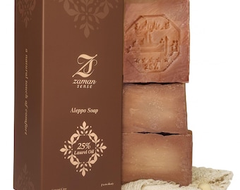 May include: A brown box of Aleppo soap with the Zaman Sense logo and the text "25% Laurel Oil." The box is next to three bars of brown soap, one stamped with an emblem and the text "25%." A natural soap product.
