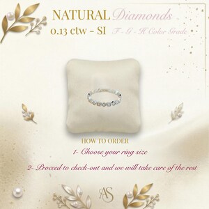 May include: A diamond ring with a geometric design, displayed on a cream-coloured pillow. The ring features multiple small diamonds. The text reads "NATURAL Diamonds" and "0.13 ctw - SI F-G-H Color Grade". Instructions on how to order are also included.