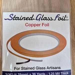 May include: A package of copper foil for stained glass art. The label reads "Stained Glass Foil" and "Copper Foil." The package also states the foil is 3/16" (4.76mm) wide and 36 yards long.