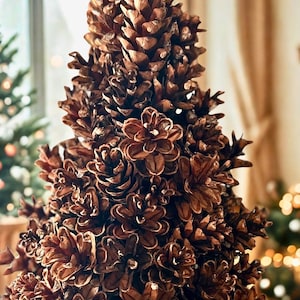 May include: A decorative Christmas tree made entirely of brown pine cones. The tree is arranged in a conical shape, with the pine cones meticulously arranged to create a textured, natural appearance. The background is blurred, suggesting a cozy indoor setting.
