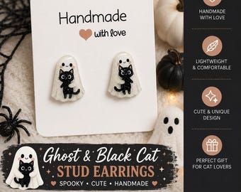 May include: A pair of stud earrings featuring a white glittery ghost holding a small black cat. The earrings are displayed on a white card with the text Handmade with love and Ghost & Black Cat STUD EARRINGS. The design includes small black eyes and pink cheeks on the ghost and cat figures.