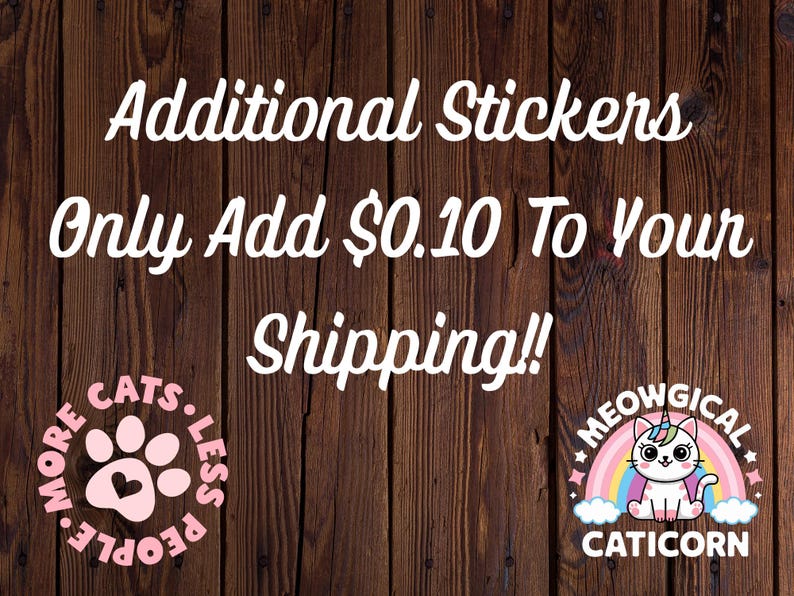 May include: Two circular stickers on a dark wood background. The left sticker is pink with a paw print and the text MORE CATS LESS PEOPLE. The right sticker features a white cat with a unicorn horn, a rainbow, and the text MEOWGICAL CATICORN.