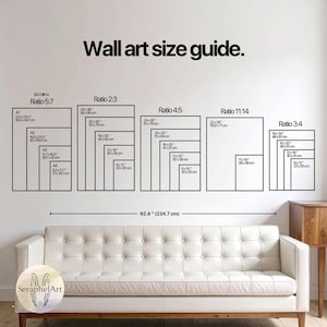 May include: A wall art size guide with various rectangular shapes labeled with dimensions in inches and centimeters. The guide includes ratios such as 5:7, 2:3, 4:5, 11:14, and 3:4. The text "Wall art size guide" is at the top. A white sofa is in the foreground.
