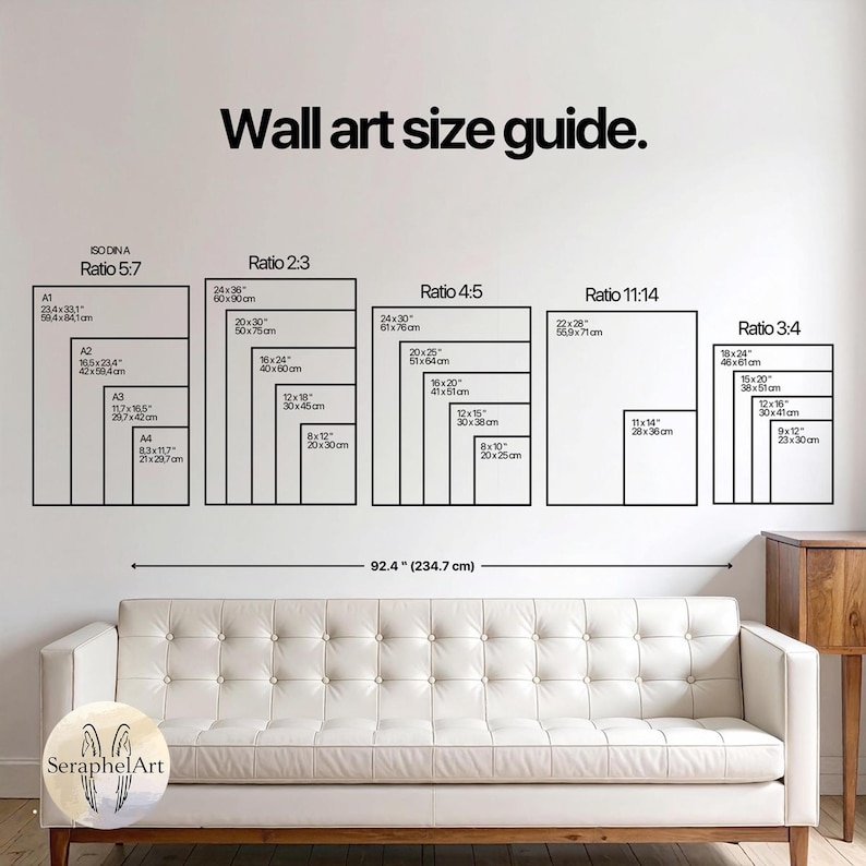 May include: A wall art size guide with various rectangular shapes labeled with dimensions in inches and centimeters. The guide includes ratios such as 5:7, 2:3, 4:5, 11:14, and 3:4. The text "Wall art size guide" is at the top. A white sofa is in the foreground.