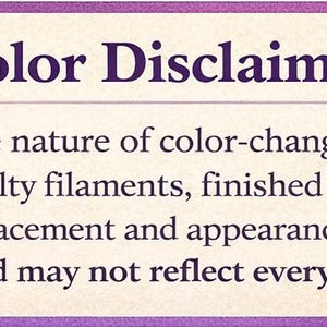 May include: A rectangular sign with a purple border and the text "Color Disclaimer:". The text explains that color-changing prints may vary in color placement and appearance. A beaker graphic is in the upper left corner.