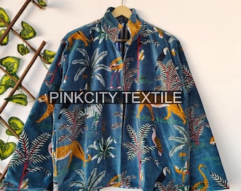 May include: A teal velvet jacket with a jungle print featuring leopards, flamingos, toucans, and palm trees. The jacket has a mandarin collar and is hanging on a wooden hanger. The text "PINKCITY TEXTILE" is printed on the jacket.