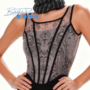 May include: A sleeveless leotard with a decorative floral pattern in grey and black. The leotard has black trim and a black bottom. The text "BalletTutu Romance Etsy" is in the upper left corner.