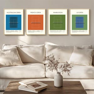 May include: Four framed prints featuring tennis court diagrams for the Australian Open, French Open, Wimbledon, and US Open. Each court is set against a different coloured background: blue, orange, green, and blue, with text labels.
