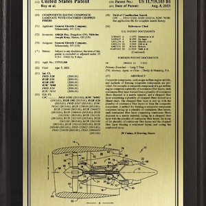 May include: A framed patent document for "Components Having Composite Laminate With Co-Cured Chopped Fibers." The document includes text, diagrams, and a gold-colored illustration of a mechanical component.