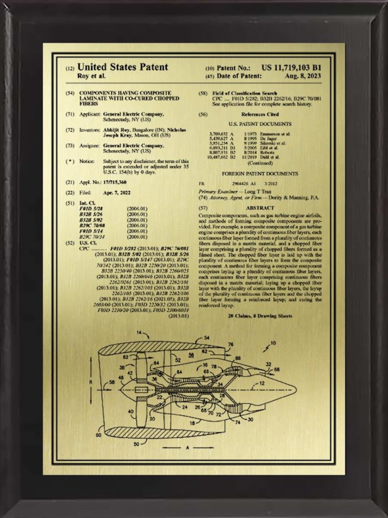 May include: A framed patent document for "Components Having Composite Laminate With Co-Cured Chopped Fibers." The document includes text, diagrams, and a gold-colored illustration of a mechanical component.