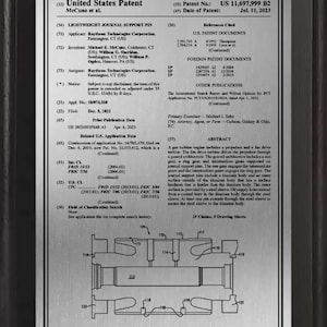 May include: A framed United States patent document, US 11,697,999 B2, dated July 11, 2023, for a lightweight journal support pin. The document includes text, diagrams, and references to related patents. The patent is assigned to Raytheon Technologies Corporation.