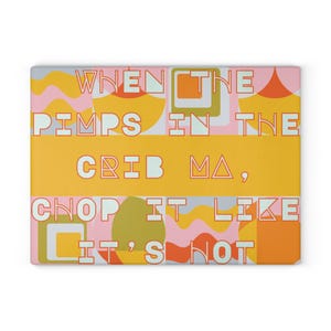May include: A rectangular glass cutting board featuring a colorful retro-inspired pattern of wavy lines, circles, and squares in shades of yellow, orange, pink, and green. The text reads: WHEN THE PIMPS IN THE CRIB MA, CHOP IT LIKE IT'S HOT.