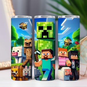 May include: Three cylindrical tumblers featuring Minecraft characters and scenes. The designs include a green Creeper, Steve with a pickaxe, and various animals like bees, pigs, and bears. The background shows a blue sky and green landscape.