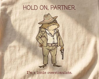 Hold On Partner I'm Overstimulated Shirt – Funny Frog Meme Graphic Tee