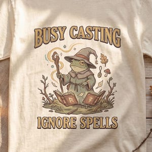 Busy Casting Ignore Spells Frog Shirt — Vintage Cottagecore Weirdcore Wizard Graphic Tee