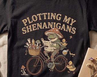 Plotting My Shenanigans Frog Shirt — Vintage Cottagecore Bicycle Storybook Graphic Tee