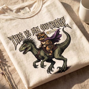 Princess Donut & Mongo Raptor Retro LitRPG Tee — Dungeon Crawler Carl “This Is an Outrage” Shirt